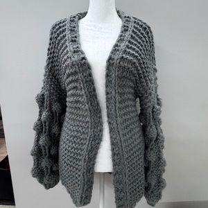 Gray knitted sweater.Size M